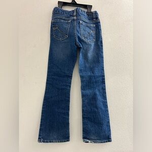 Bootcut denim blue kids jeans with heart detail on back pockets. Girls 6/7